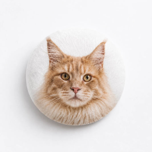 Custom plush pin badge featuring Maine Coon cat portrait with soft fabric texture and personalized pet accessory design.