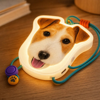 Close-up of custom pet night light with warm LED edge and hanging strap detail